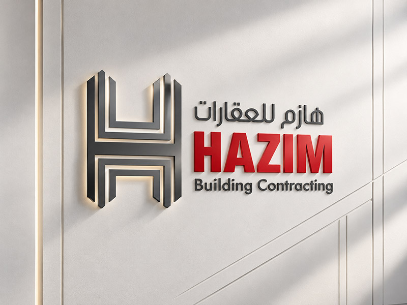 Hazim Building Contracting bilingual logo on office wall signage, designed in Dubai